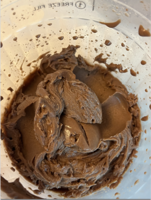 vegan chocolate ice cream in the creami bowl made from almond pudding